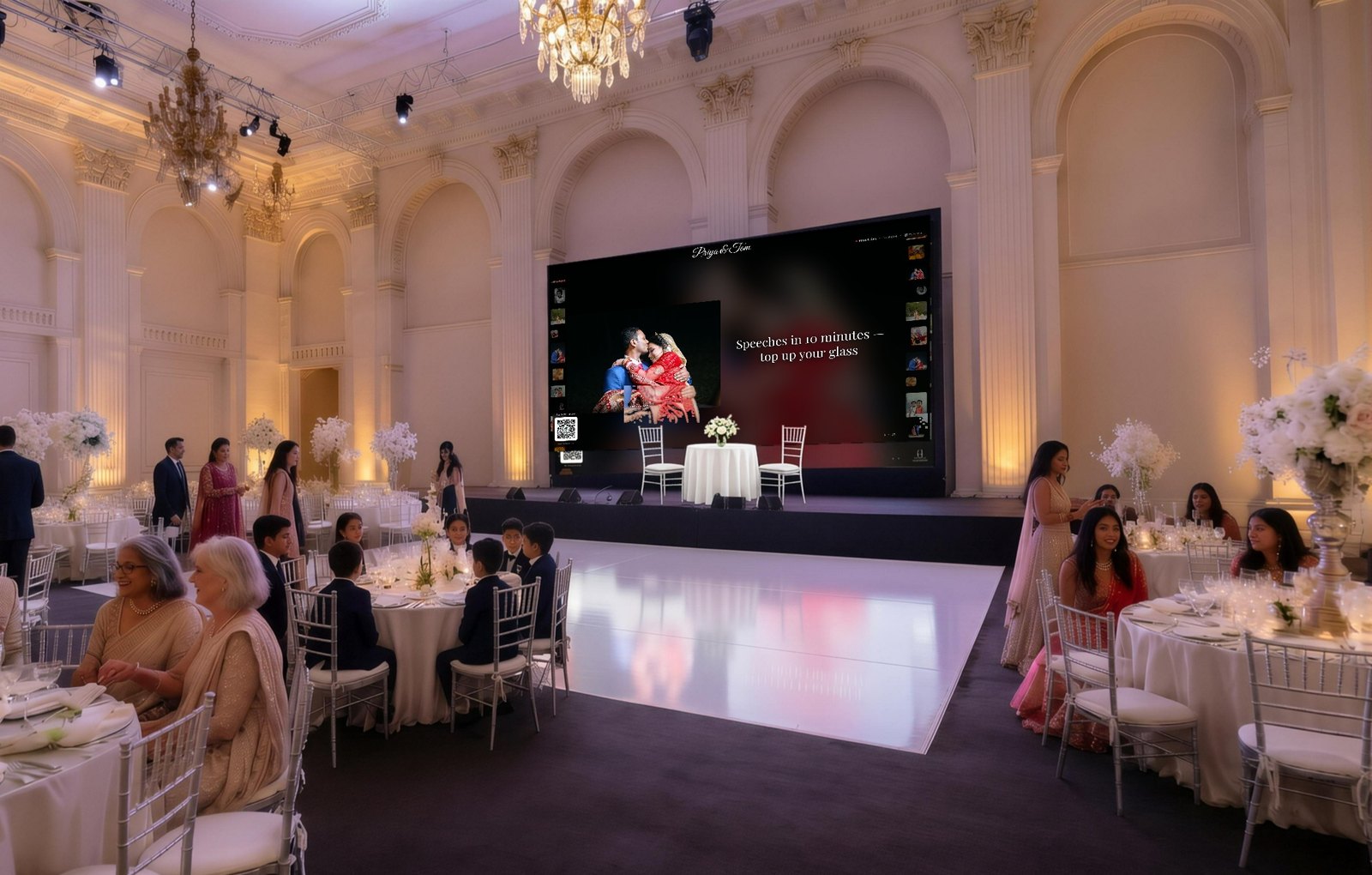 A wedding reception where the venue screen shows guest photos alongside an announcement reading 'Speeches in 10 minutes'